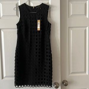 Brand new Donna Karan, New York Black A line dress with circle holes.